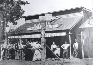 black and white photo of people standing in front of a building in Chandler in the 1900s