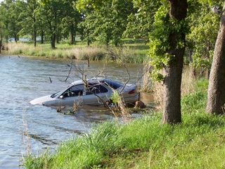 car sinking in a lake